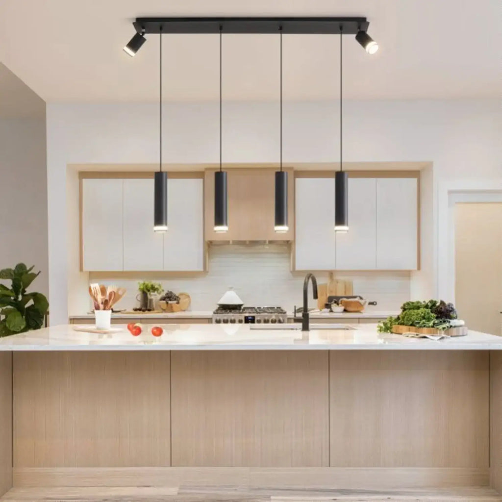 Hanging Light for Modern Kitchen Island | Adjustable Spotlights illuminate a sleek kitchen with white cabinets and island.