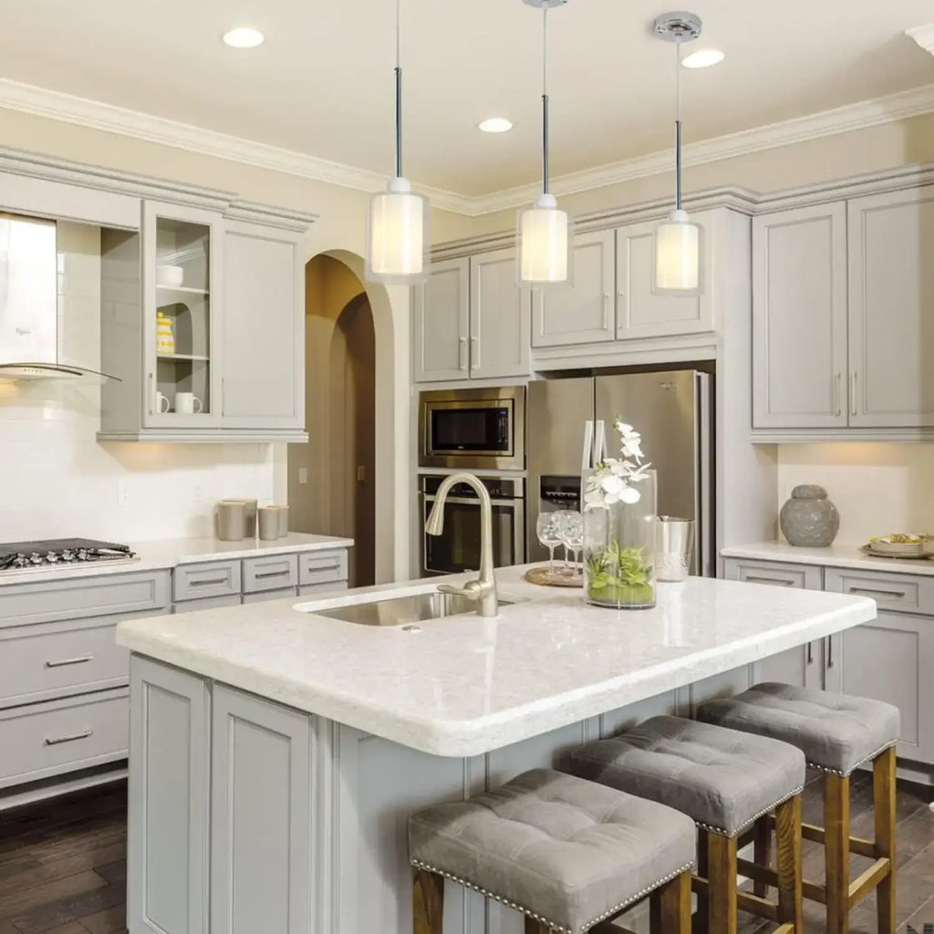Modern Glass Pendant Light with Chrome Nickel Finish for Kitchen Island illuminating a stylish kitchen island.