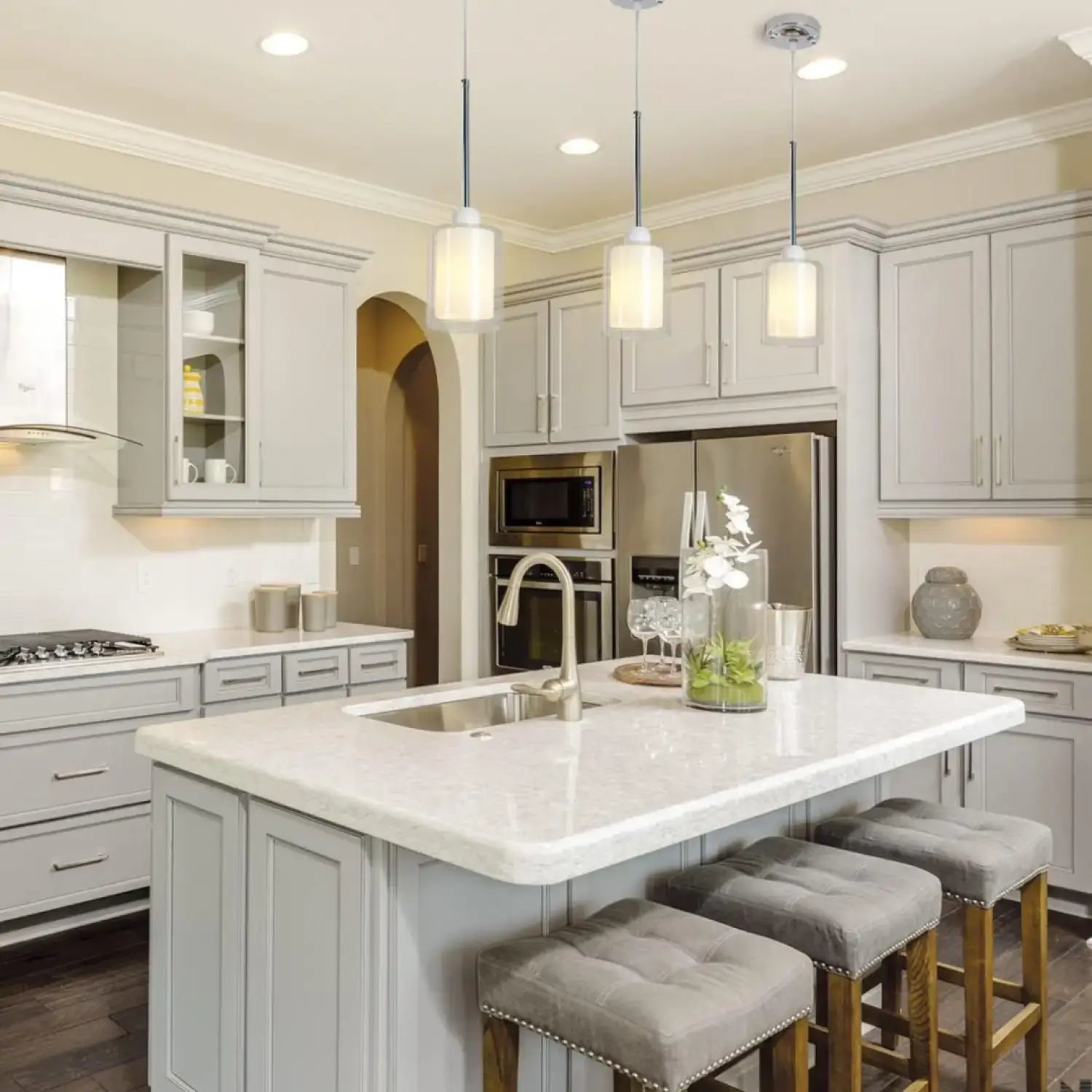 Modern Glass Pendant Light with Chrome Nickel Finish for Kitchen Island illuminating a stylish kitchen island.