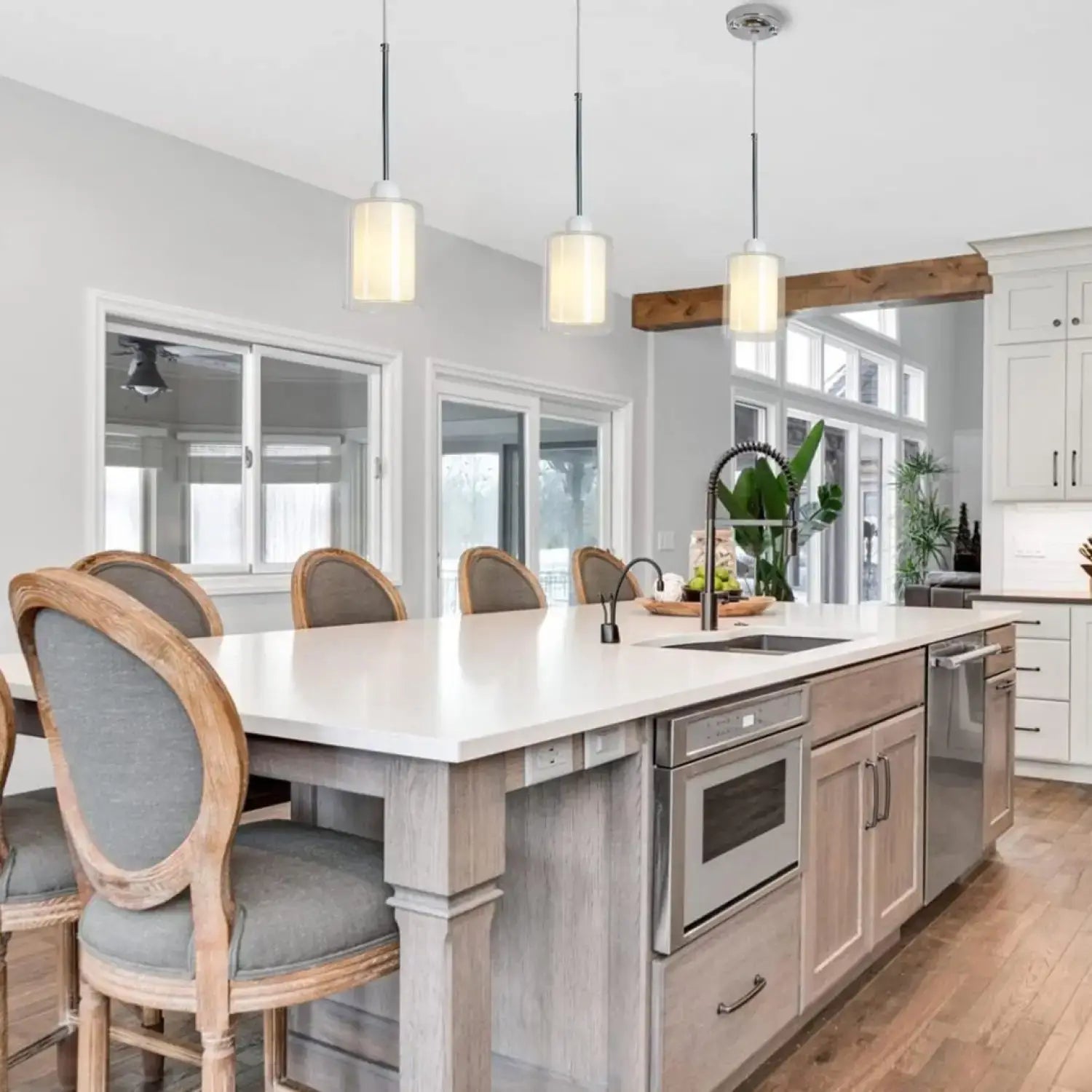 Modern Glass Pendant Light with Chrome Nickel Finish for Kitchen Island hanging above a stylish kitchen island.